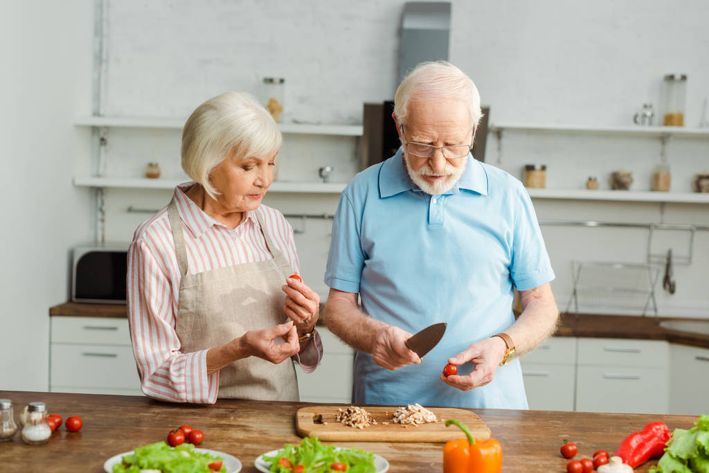 senior couple cooking together