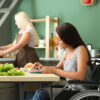 woman in wheelchair eating
